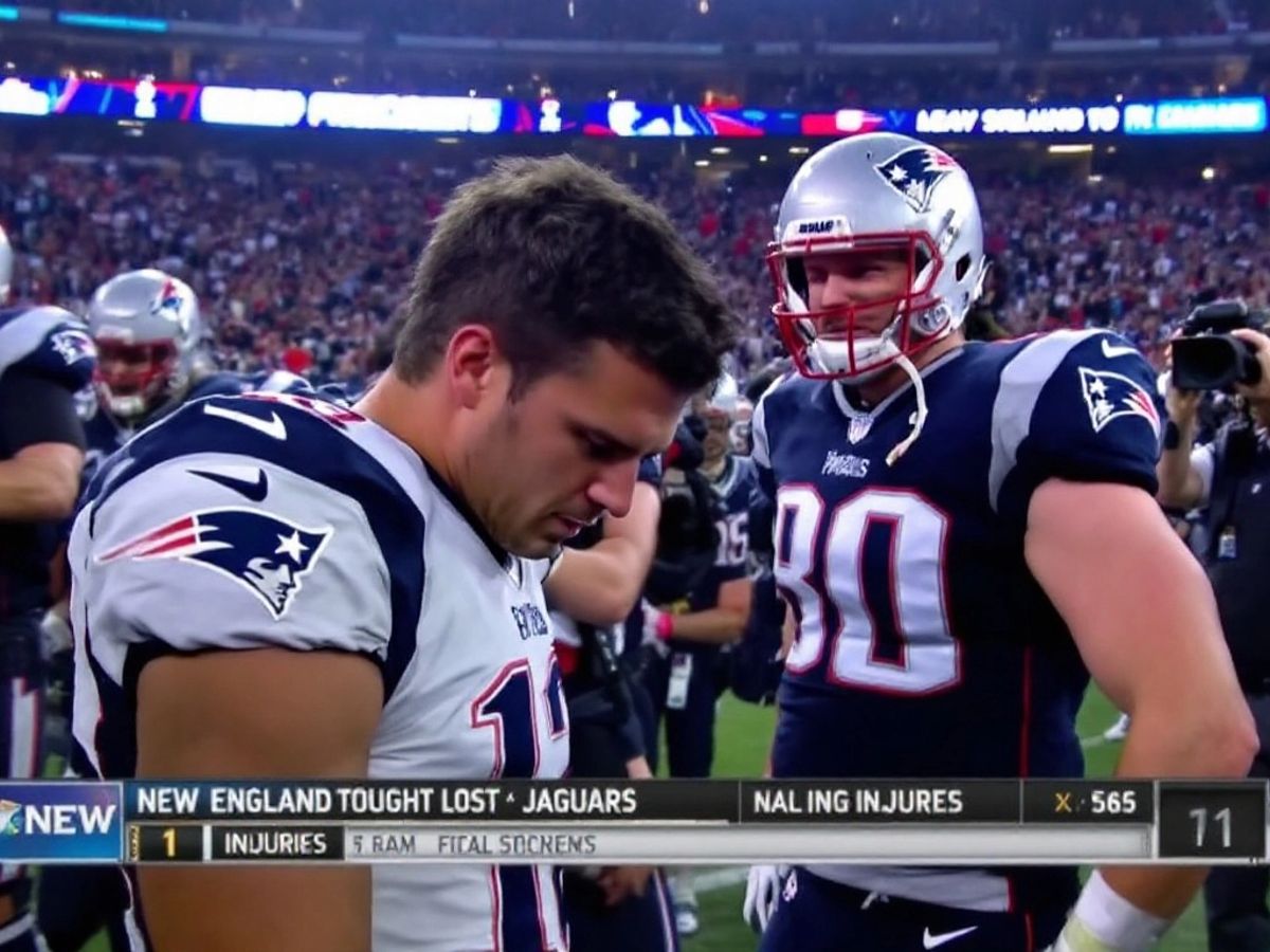 Patriots players look concerned on the sidelines after loss.