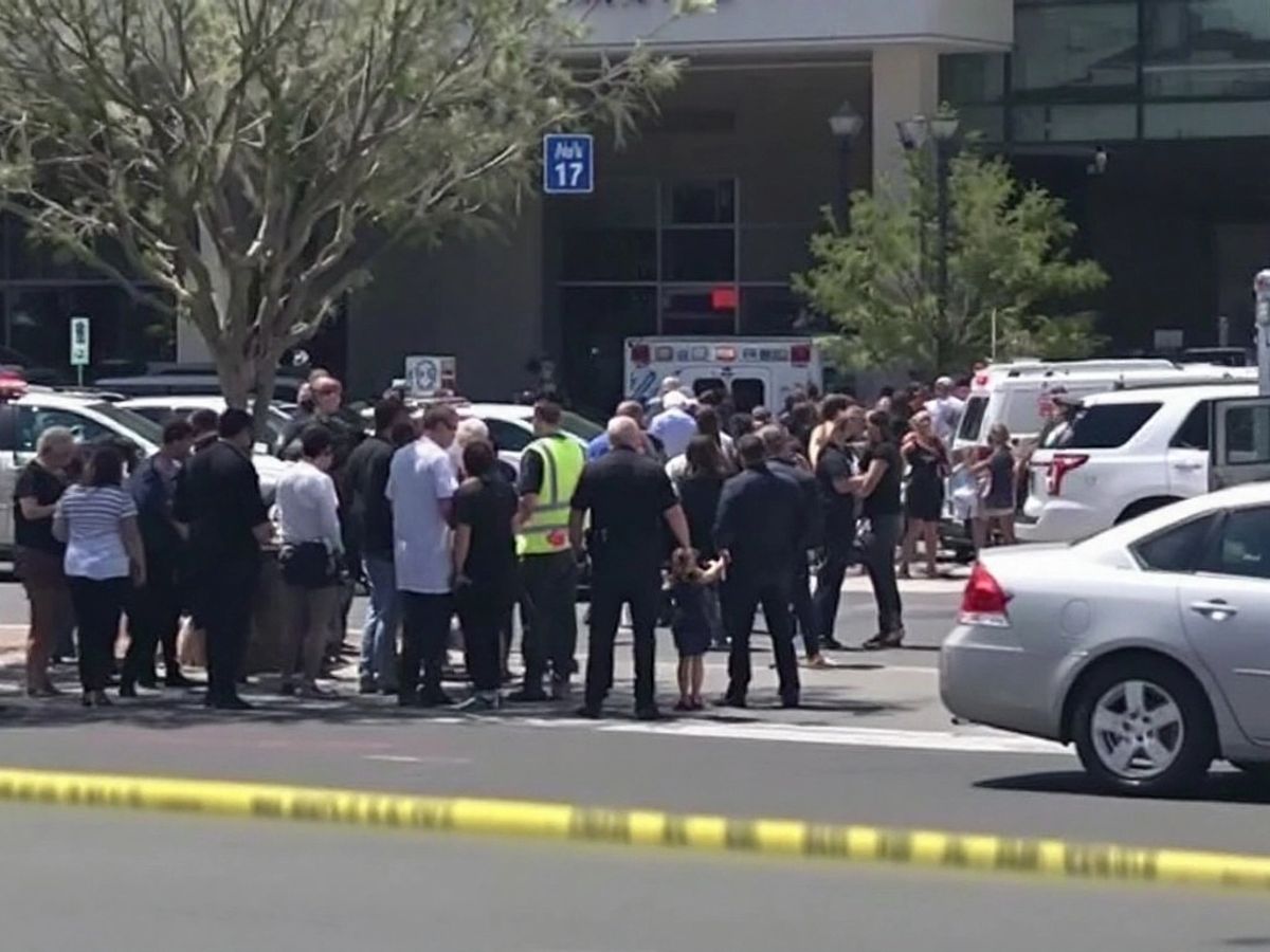 Crowd outside hospital after dog attack on boxer.