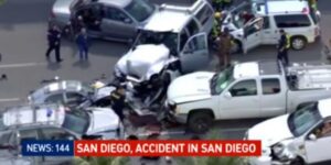 Car accident scene in San Diego with damaged vehicles.