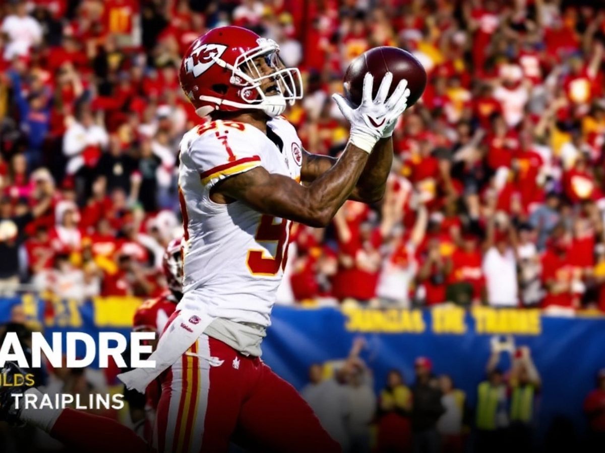 DeAndre Hopkins in Chiefs uniform catching a football.