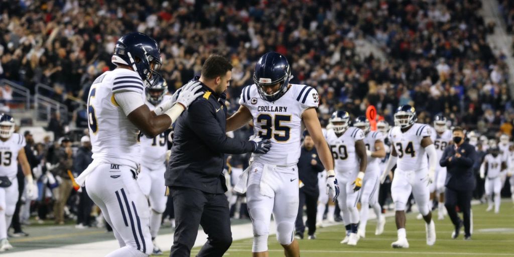 College football players on the field during a game.