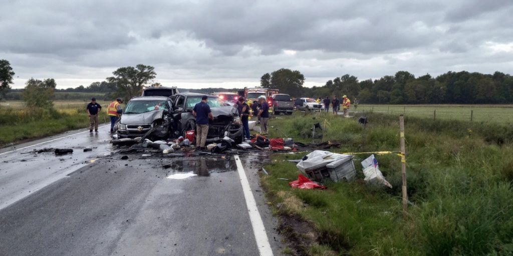 Emergency responders at a tragic car collision site.